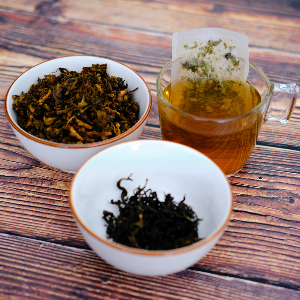 
                  
                    cup of tea with a tea bag and two white bowls with rhubarb root in one and tea in the other
                  
                